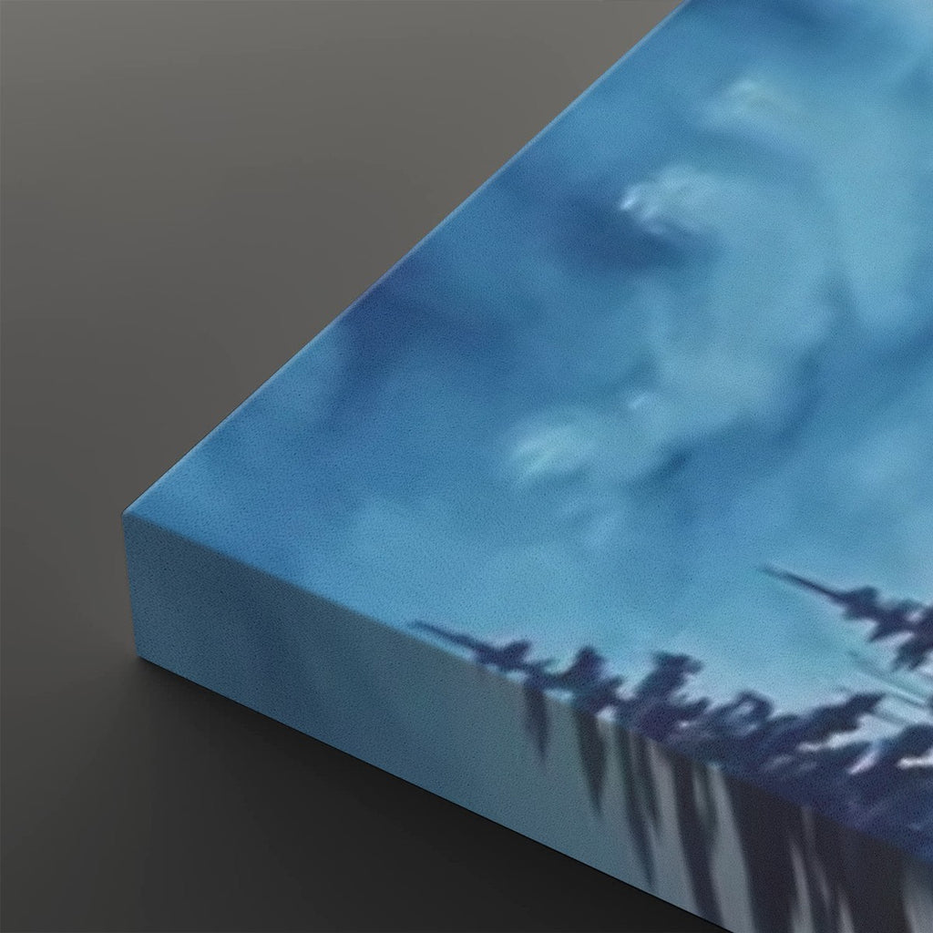 A close-up of a square canvas print showing its wrapped edge, featuring a blue-toned abstract landscape or sky scene with dark silhouetted shapes along the bottom, set against a dark gray background.
