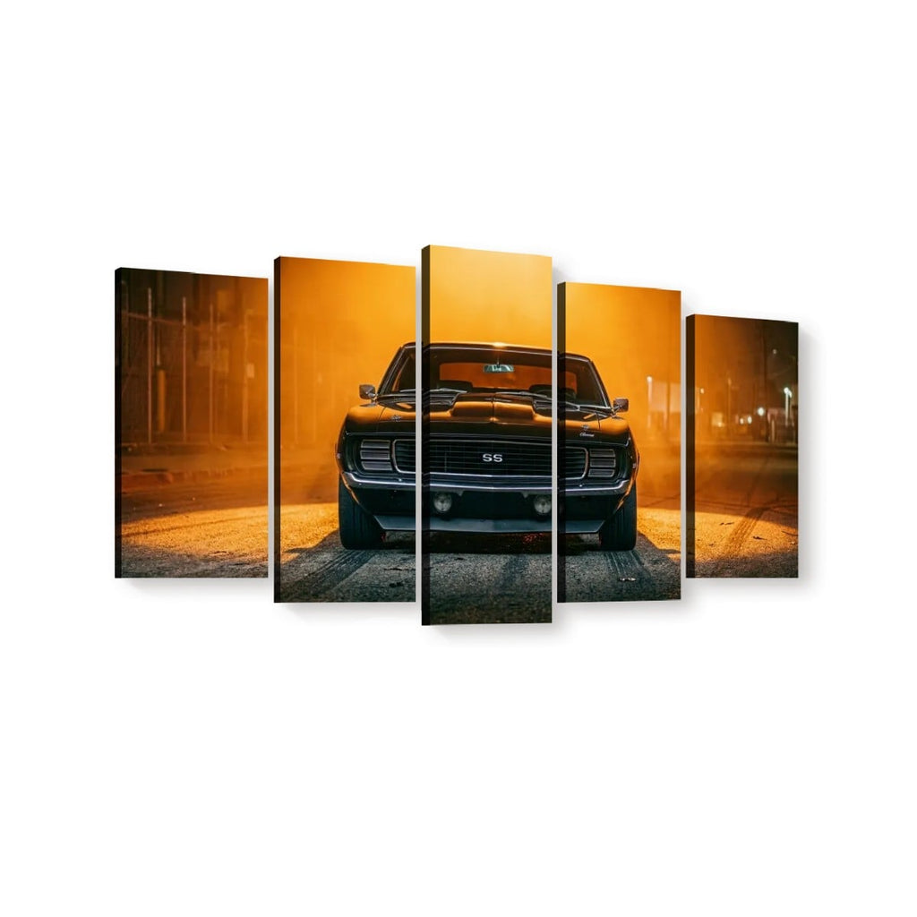 A five-panel canvas wall art set depicting a black muscle car from the front, illuminated by a dramatic orange-yellow streetlight at night.