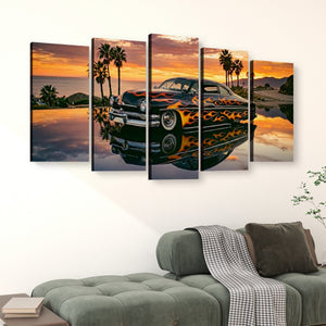 A five-panel canvas wall art set hanging above a green sofa in a living room. The artwork shows a black Mercury Sled classic car with orange flames, palm trees, and a sunset reflection on water.