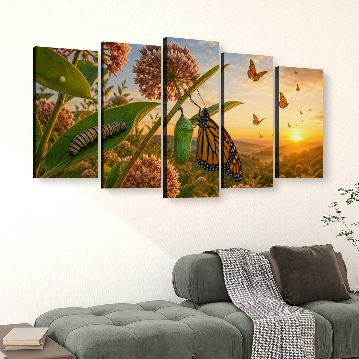 A five-panel canvas wall art set depicting a monarch butterfly, chrysalis, and wildflowers at sunset, displayed above a green sofa in a living room setting.