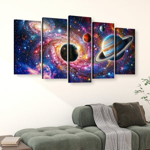 A five-panel canvas wall art set depicting a colorful outer space scene with planets, stars, and nebulae, displayed above a green sofa in a living room setting.