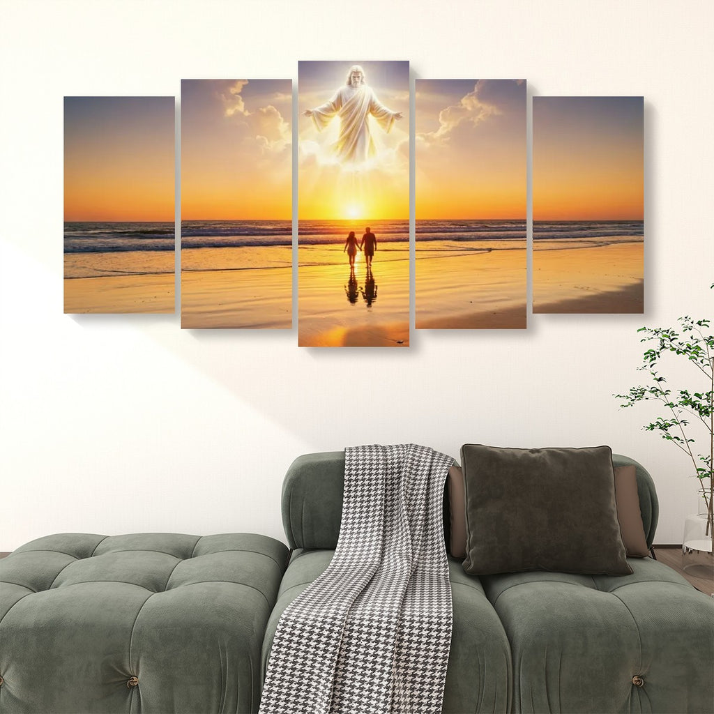 A five-panel canvas wall art set depicting a beach sunset with a glowing figure floating above two small silhouetted figures, displayed above a green sofa in a living room setting.
