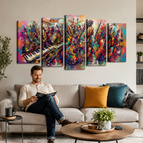 A man sits on a beige sofa in a living room, reading a book. Above him hangs a five-panel canvas wall art set depicting a colorful, abstract musical scene with guitars, pianos, and drums.