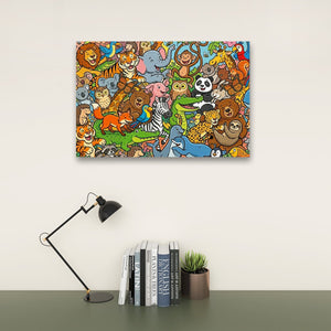 A colorful canvas wall art print featuring a dense cartoon illustration of various animals, displayed on a beige wall above a dark green table with a black desk lamp, books, and a small potted succulent.