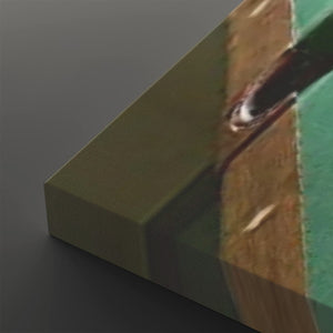 A close-up of a rectangular block or panel with a textured olive green top surface and a printed side showing a brown and green abstract pattern, photographed on a dark gray background.