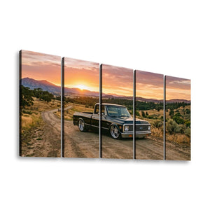 A five-panel canvas wall art print depicting a vintage 1970 Chevy C10 Fleetside pickup truck parked on a dirt road at sunset, with mountains and dry hills in the background.