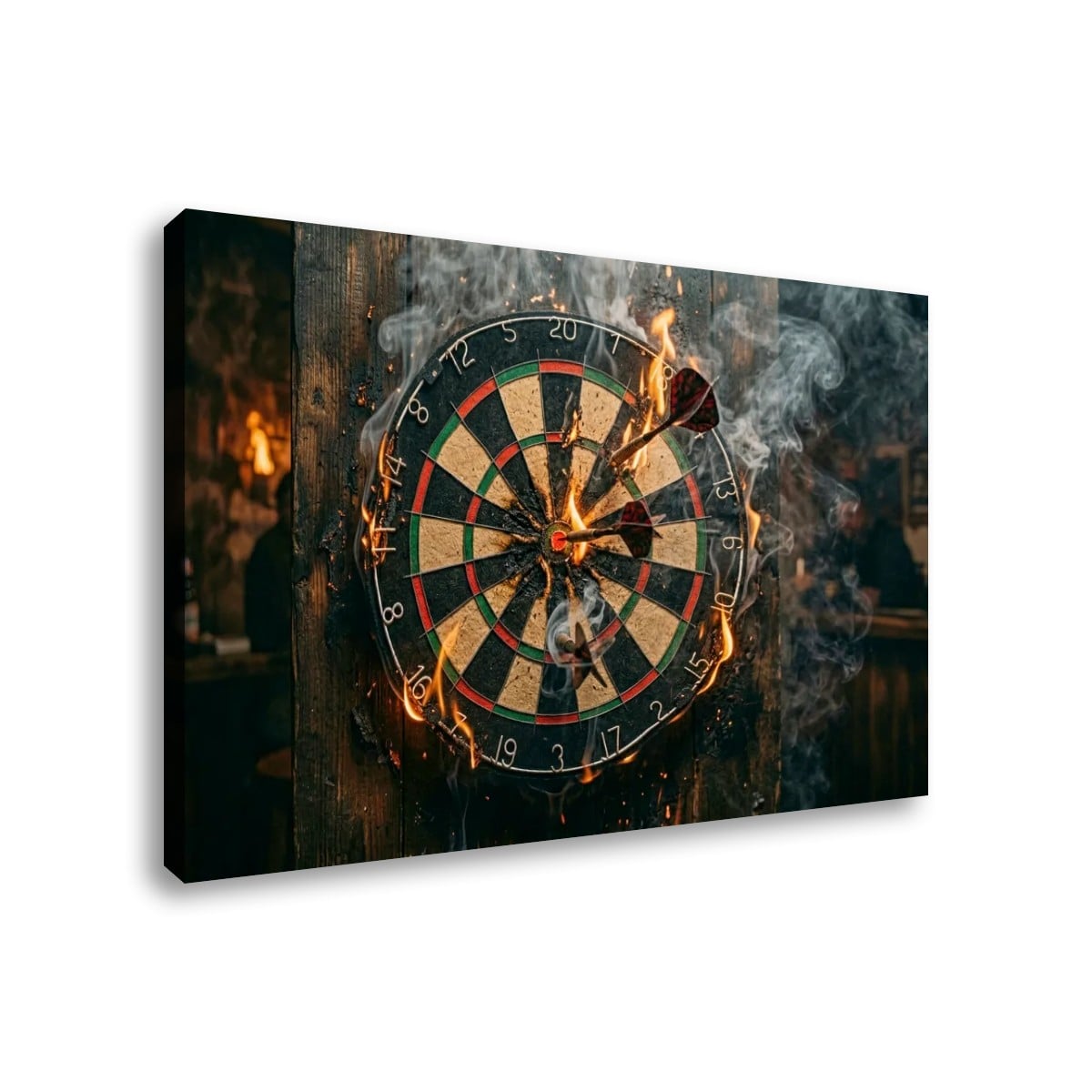 A rectangular wall art print or canvas showing a burning dartboard with darts stuck in the center, smoke, and flames, photographed against a plain white background.