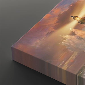 A close-up of a rectangular canvas print showing a painted sunset or sunrise scene with warm orange, pink, and gold tones, photographed on a dark gray background.