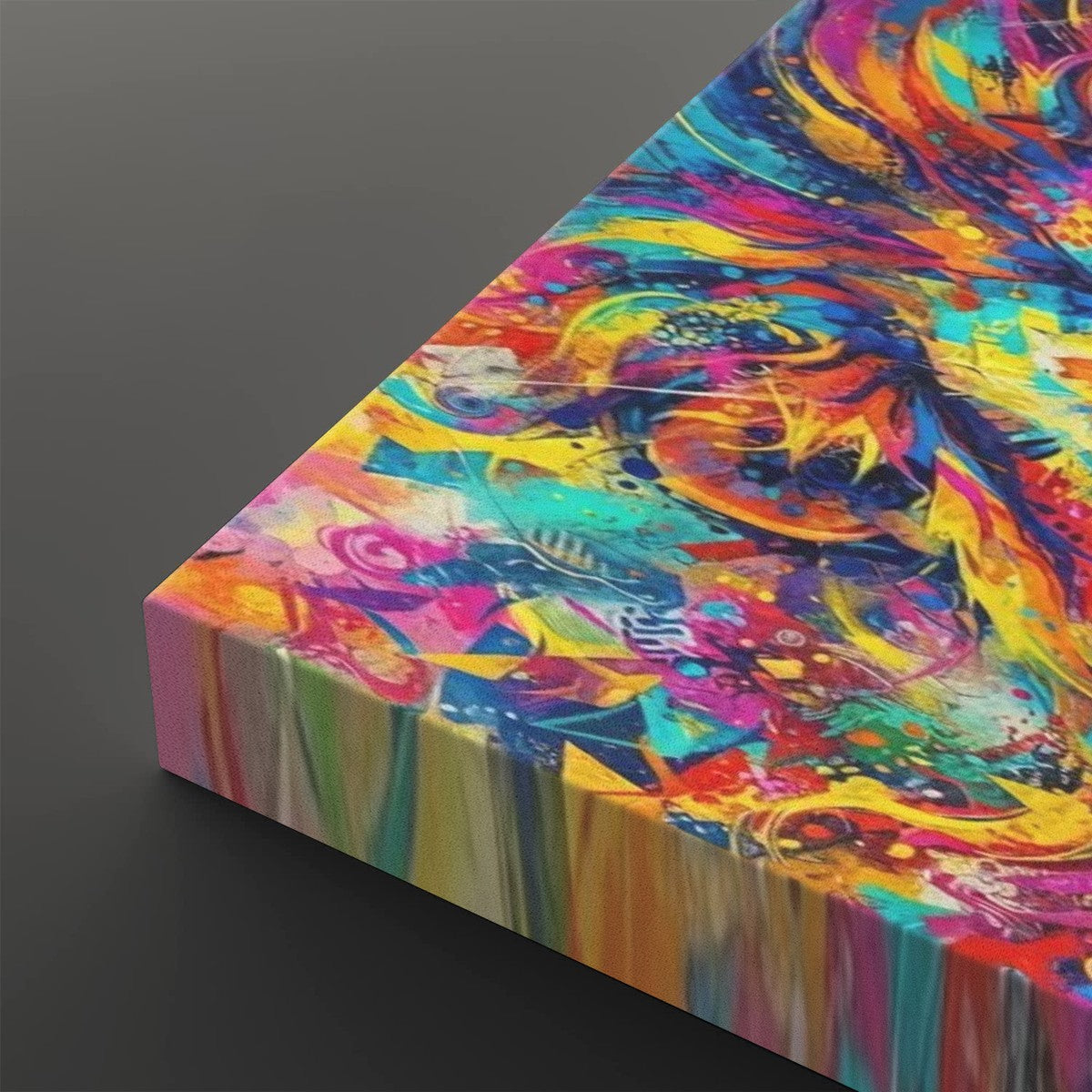 A close-up of a colorful abstract canvas print showing vivid swirling brushstrokes in blue, yellow, pink, orange, and purple, photographed at an angle against a dark gray background.