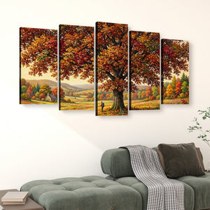 A five-panel canvas wall art set depicting a large autumn tree with colorful foliage over a rolling landscape, displayed above a green sofa in a living room setting.