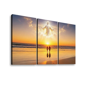 Three-panel canvas wall art showing a beach sunset scene with a glowing white figure above two silhouetted figures walking on the sand, displayed against a light gray background.