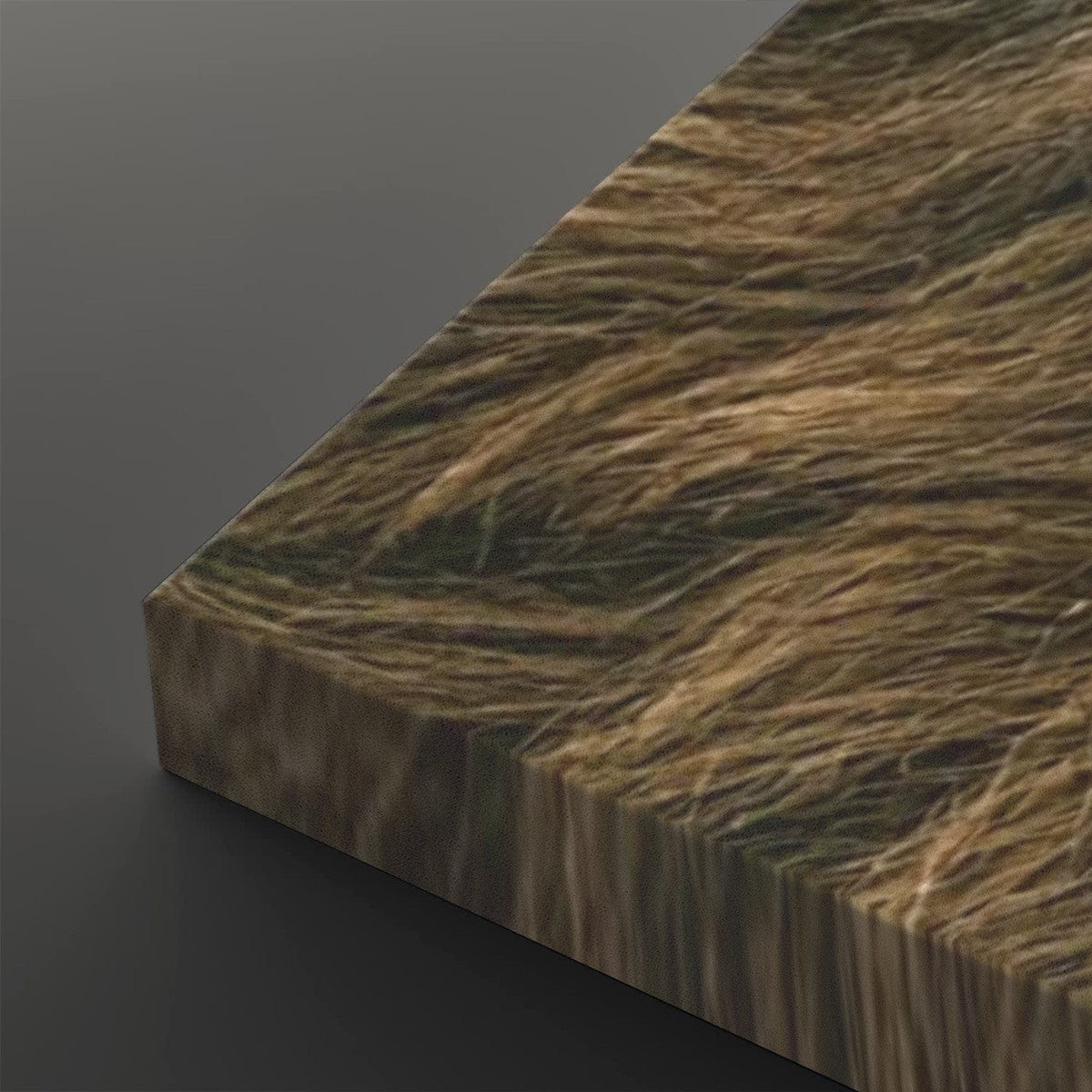 A close-up of a rectangular panel with a realistic brown and tan faux fur or grass-like texture, shown at an angle against a dark gray background.