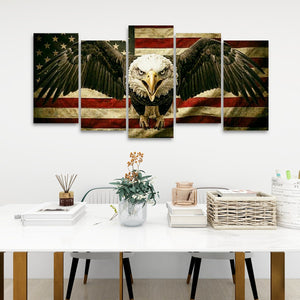 A five-panel canvas wall art set depicting a bald eagle with spread wings over a distressed American flag, displayed on a white wall above a styled dining table.