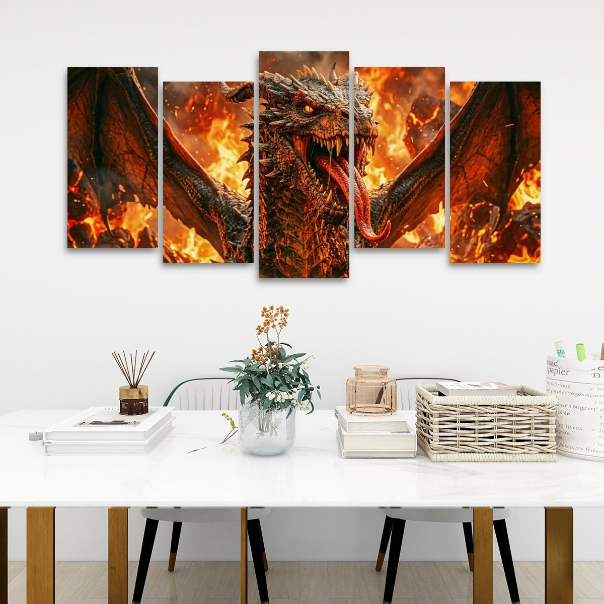 A 5-panel canvas wall art set depicting a fiery dragon with wings spread, displayed above a white dining table in a modern room setting.