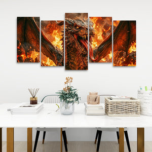A 5-panel canvas wall art set depicting a fiery dragon with wings spread, displayed above a white dining table in a modern room setting.