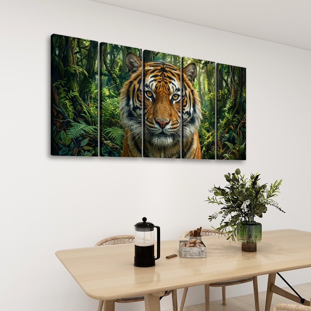 A five-panel canvas wall art set depicting a close-up tiger face in a lush green jungle, displayed on a white wall above a light wood dining table with chairs and a plant.