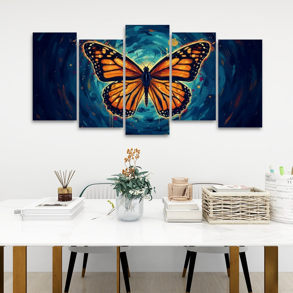 A five-panel canvas wall art set depicting a large orange monarch butterfly over a swirling blue and teal background, displayed above a white table in a modern room setting.