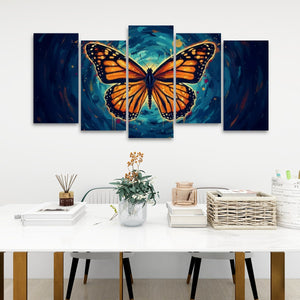 A five-panel canvas wall art set depicting a large orange monarch butterfly over a swirling blue and teal background, displayed above a white table in a modern room setting.