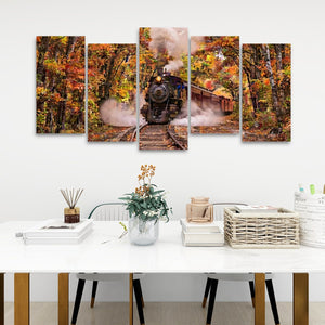 A 5-panel canvas wall art set depicting a vintage steam train traveling through an autumn forest, displayed on a white wall above a styled dining table with chairs, books, and a vase.