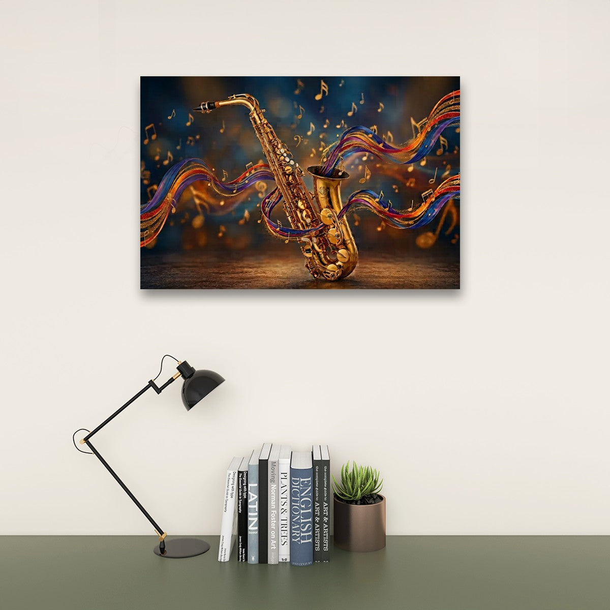A rectangular wall art print showing a golden saxophone with colorful flowing musical notes, displayed above a desk with a black lamp, books, and a small succulent against a light wall.
