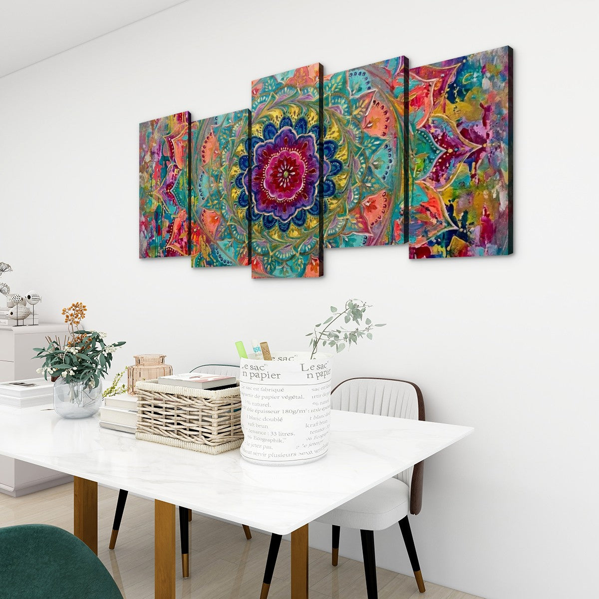 A five-panel canvas wall art set featuring a vibrant, colorful mandala and abstract floral design, displayed on a white wall above a dining table in a modern room setting.
