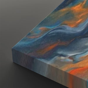 Abstract canvas wall art showing a marbled swirl pattern in shades of blue, gray, white, and orange, photographed at an angle on a dark gray background.