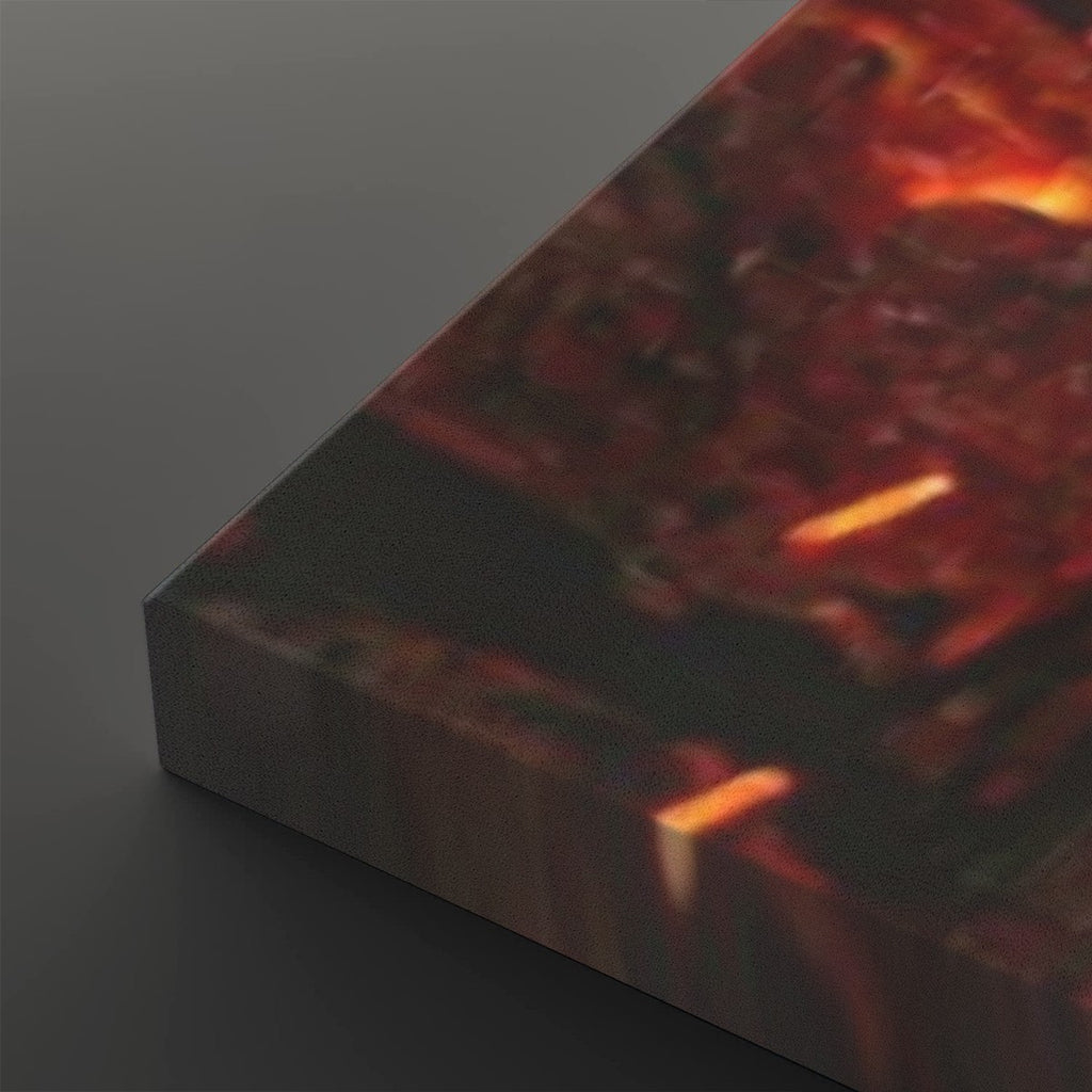 A close-up of a rectangular block or panel with a dark, fiery abstract print in red, orange, and black tones, shown against a dark gray background.