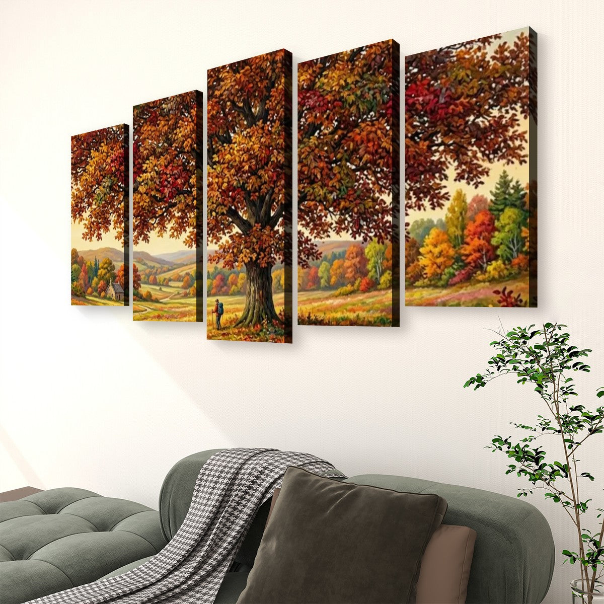 A five-panel canvas wall art set depicting an autumn forest landscape with a large tree and colorful foliage, displayed above a gray sofa in a living room setting.