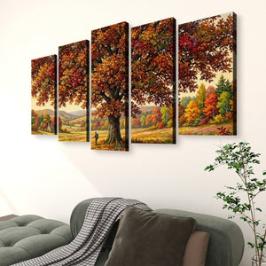 A five-panel canvas wall art set depicting an autumn forest landscape with a large tree and colorful foliage, displayed above a gray sofa in a living room setting.