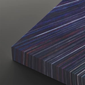 A close-up of a rectangular panel with a dark, striped pattern in shades of purple, blue, and red, shown on a dark gray background.