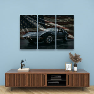 A three-panel canvas wall art print depicting a black 1972 Corvette sports car in front of a distressed American flag, displayed on a light blue wall above a wooden console table with decorative items.