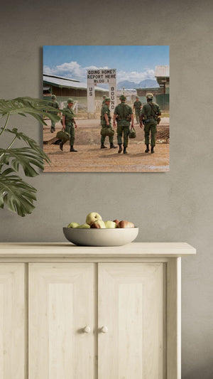 Canvas print of soldiers on a wall above a cabinet with fruit bowl
