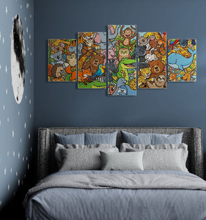 A five-panel canvas wall art set depicting a colorful cartoon animal nursery scene, displayed on a dark blue-gray bedroom wall above a bed with gray bedding.