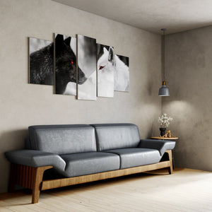Gray sofa in a living room with wall art of wolves.