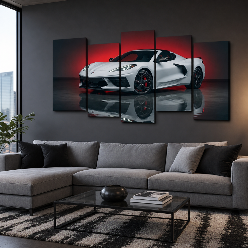 A 5-panel canvas wall art set depicting a white sports car with red lighting and a dark reflection, displayed on a dark gray wall above a modern gray sectional sofa in a living room setting.