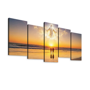 A five-panel canvas wall art set showing a beach sunset scene with a glowing figure in the sky above two small silhouetted figures walking on the sand.