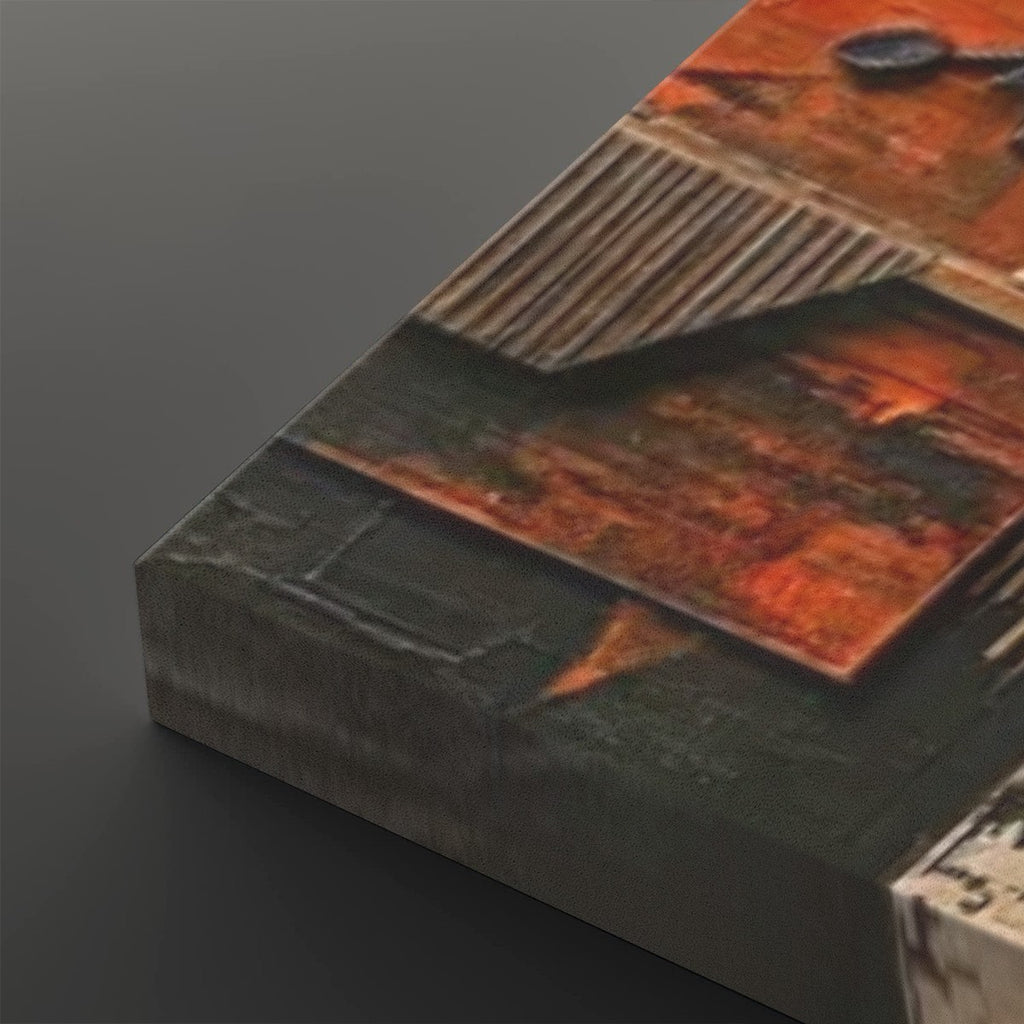 A close-up of a textured canvas print showing an abstract industrial design with rusted orange panels, corrugated metal textures, and dark gray sections, displayed on a dark gray background.