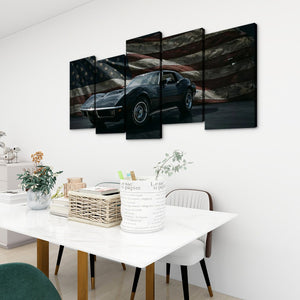 A 4-panel canvas wall art set depicting a black 1972 Corvette sports car against a distressed American flag background, displayed in a modern dining room setting above a white table.