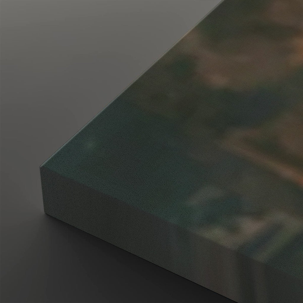 A close-up of a rectangular panel or board shown at an angle, with a dark teal-green top surface and a gray side edge, photographed against a dark gray background.
