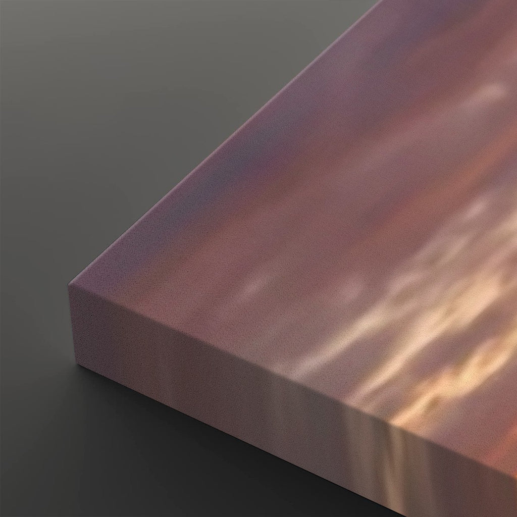 A close-up of a rectangular panel or block with a smooth iridescent surface showing pink, purple, and warm gold tones, photographed on a dark gray background.
