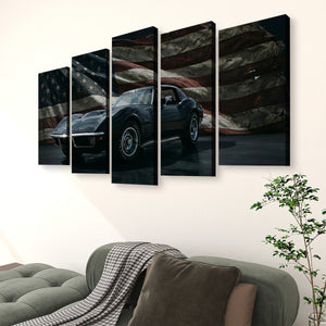 A 5-panel canvas wall art set depicting a black 1972 Corvette sports car against a distressed American flag background, displayed on a light beige wall above a green sofa in a living room setting.