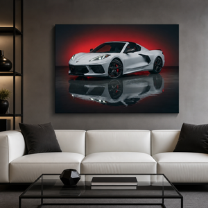 A large canvas wall art print depicting a white sports car with a red glow and reflection, displayed on a gray wall above a modern white sofa in a living room setting.
