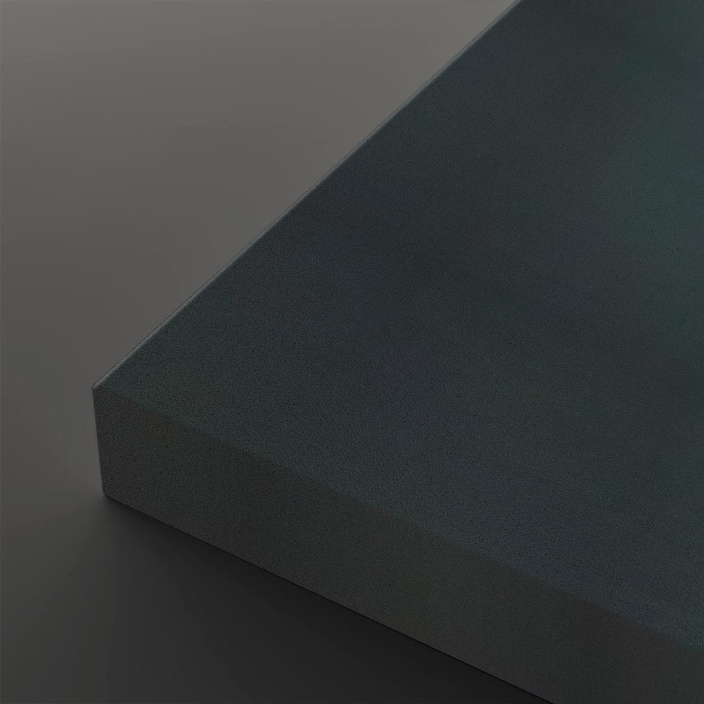 A close-up studio shot of a matte dark gray rectangular block or panel corner, shown against a matching dark gray background.