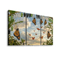 A three-panel canvas wall art set depicting monarch butterflies hanging from green chrysalises against a cloudy sky at sunset, shown on a white background.