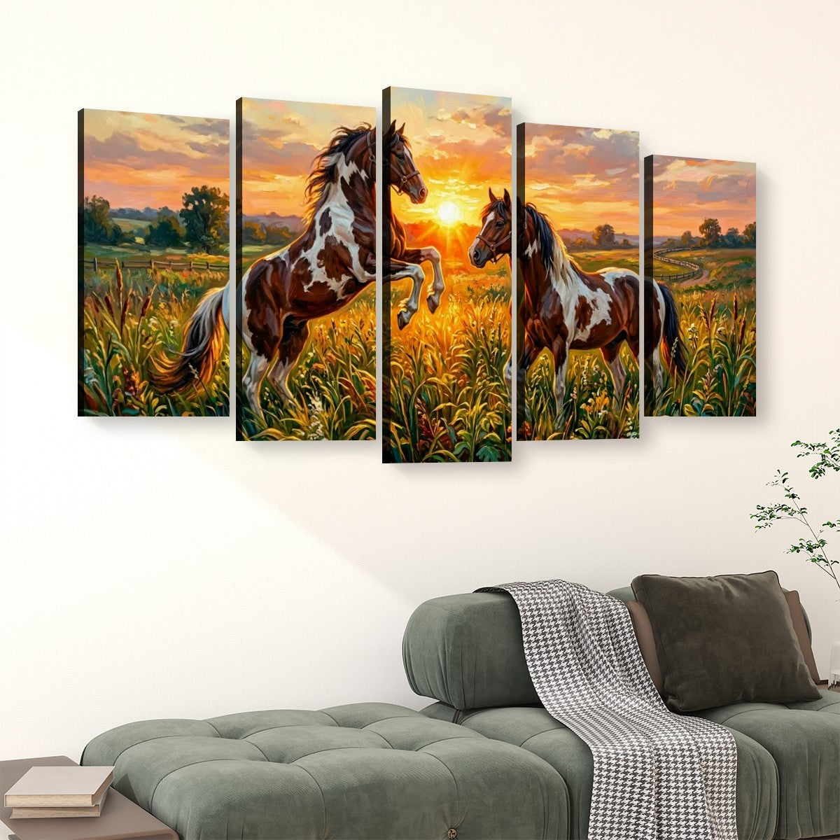 A five-panel canvas wall art set depicting two brown and white horses in a golden field at sunset, displayed above a green sofa in a living room setting.