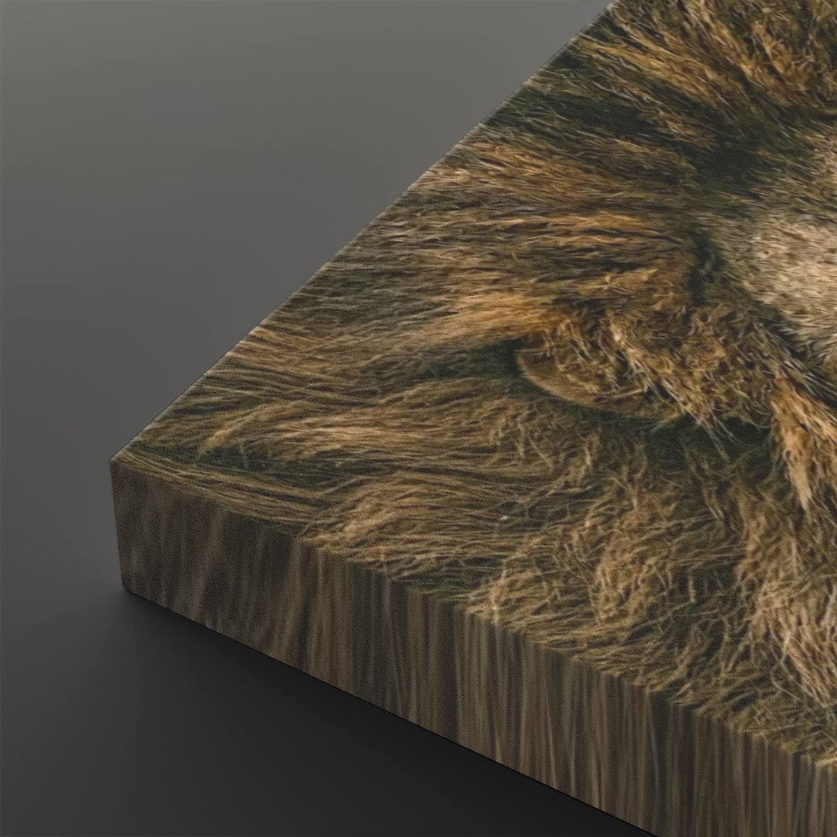 A close-up angled view of a textured brown faux fur or animal-print material sample with a wood-grain side edge, shown on a dark gray background.