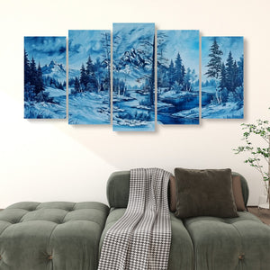 A five-panel canvas wall art set depicting a blue-toned snowy mountain landscape with pine trees and a river, displayed above a green sofa in a living room setting.