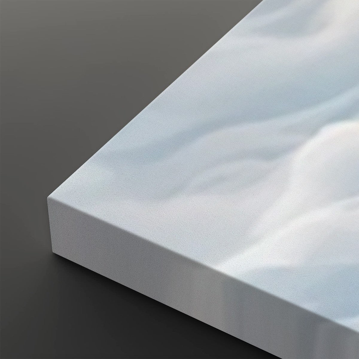A close-up of a white rectangular panel or tile with a smooth, slightly glossy surface and soft gray-blue marbled or cloudy highlights, shown on a dark gray background.