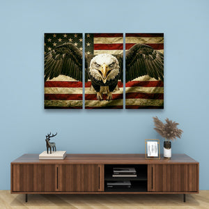A three-panel canvas wall art set depicting a bald eagle in front of a distressed American flag, displayed on a light blue wall above a wooden console table with decorative items.