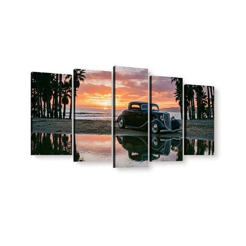 A five-panel canvas wall art set depicting a vintage black 1934 Ford Coupe car parked on a beach at sunset, with palm trees, ocean, and water reflections shown across the panels.